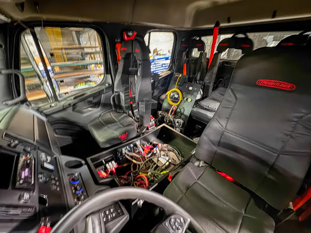 Cab interior upfit with exposed console area, photo 26 of 303.